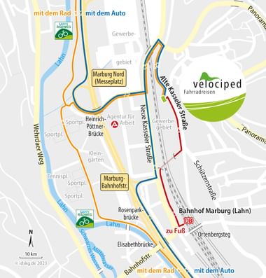 Velociped Anfahrtskarte zum Bahnhof Marburg Karte mit Rad- und Autowegen zu Velociped in Marburg. Blaue Linien zeigen Autorouten, orange Linien Radwege entlang der Lahn.