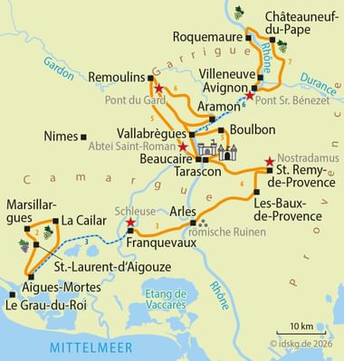 Map showing cycling route from Aigues-Mortes through Provence and Camargue, passing Arles, Avignon, and Châteauneuf-du-Pape along rivers Rhône and Gardon.