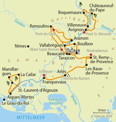 Karte mit Radroute ab Avignon durch Provence und Camargue. Orange Linie verbindet Städte wie Arles, Tarascon und Aigues-Mortes.
