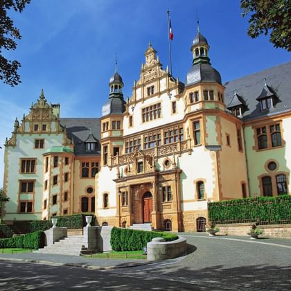 Governor's Palace in Metz Governor's Palace in Metz with ornate Renaissance architecture, featuring multiple towers, decorative stonework, and manicured gardens.