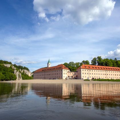 Riverbank view of Weltenburg Monastery